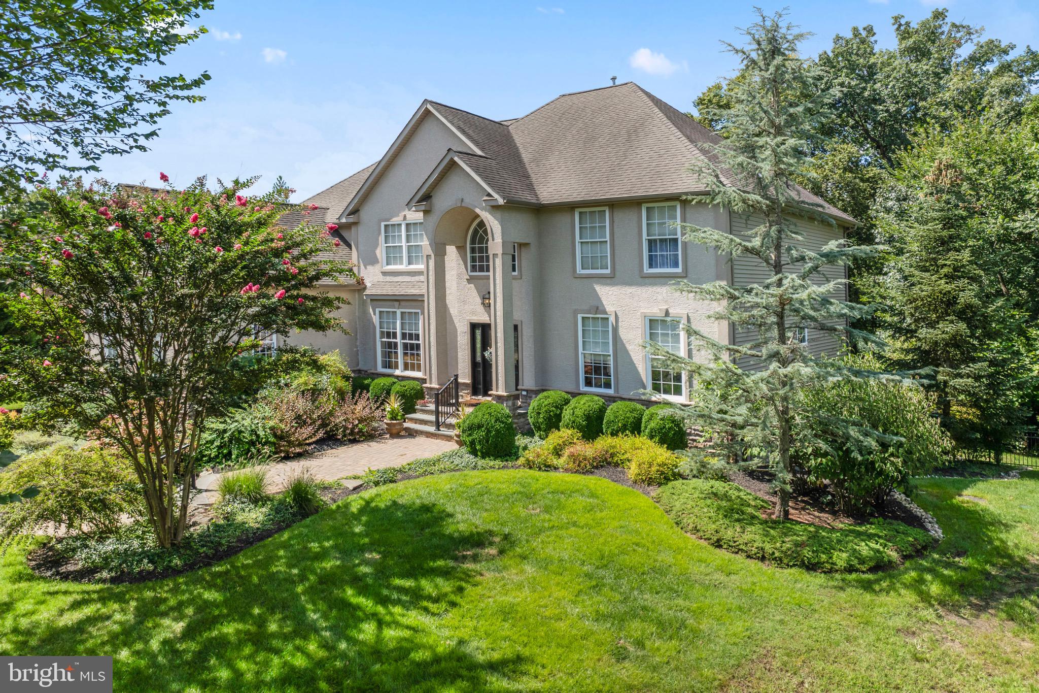 23 Regal's Court Swedesboro, NJ 08085 - Photo 3 of 74 a front view of a house with a yard and potted plants