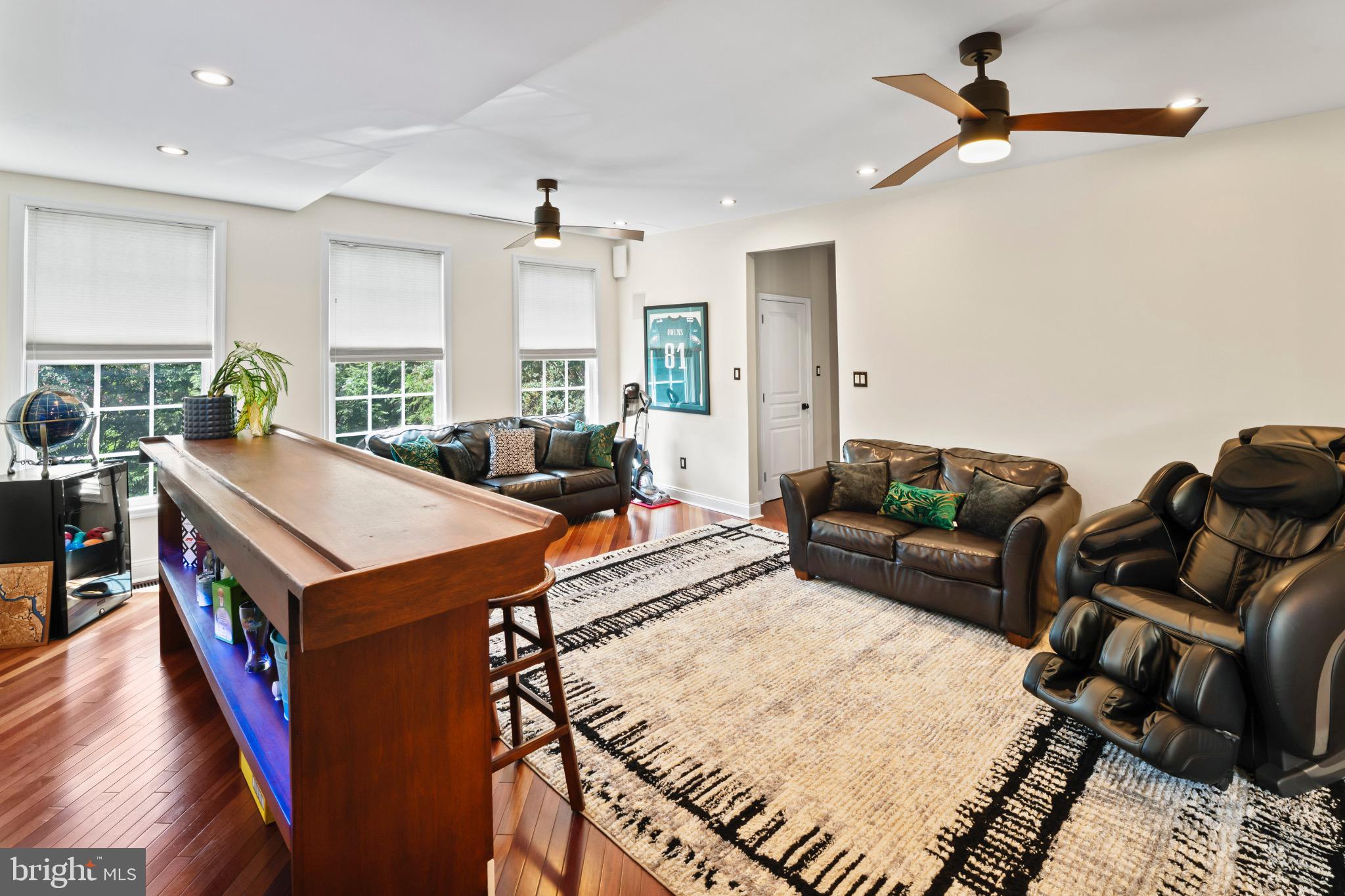 23 Regal's Court Swedesboro, NJ 08085 - Photo 31 of 74 a living room with furniture a rug and a chandelier