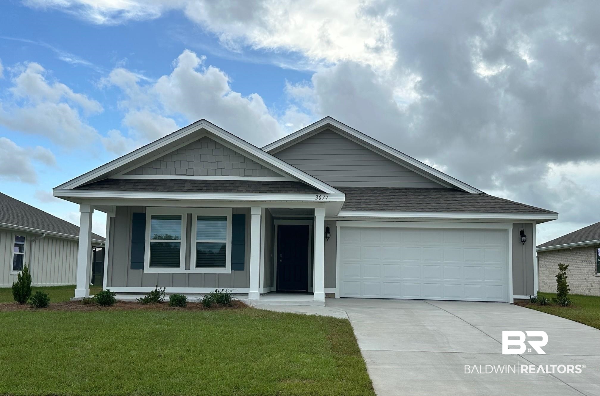 3077 Ingrid Lane Foley, AL 36535 - Photo 1 of 24 View of front of house featuring a front lawn and a garage