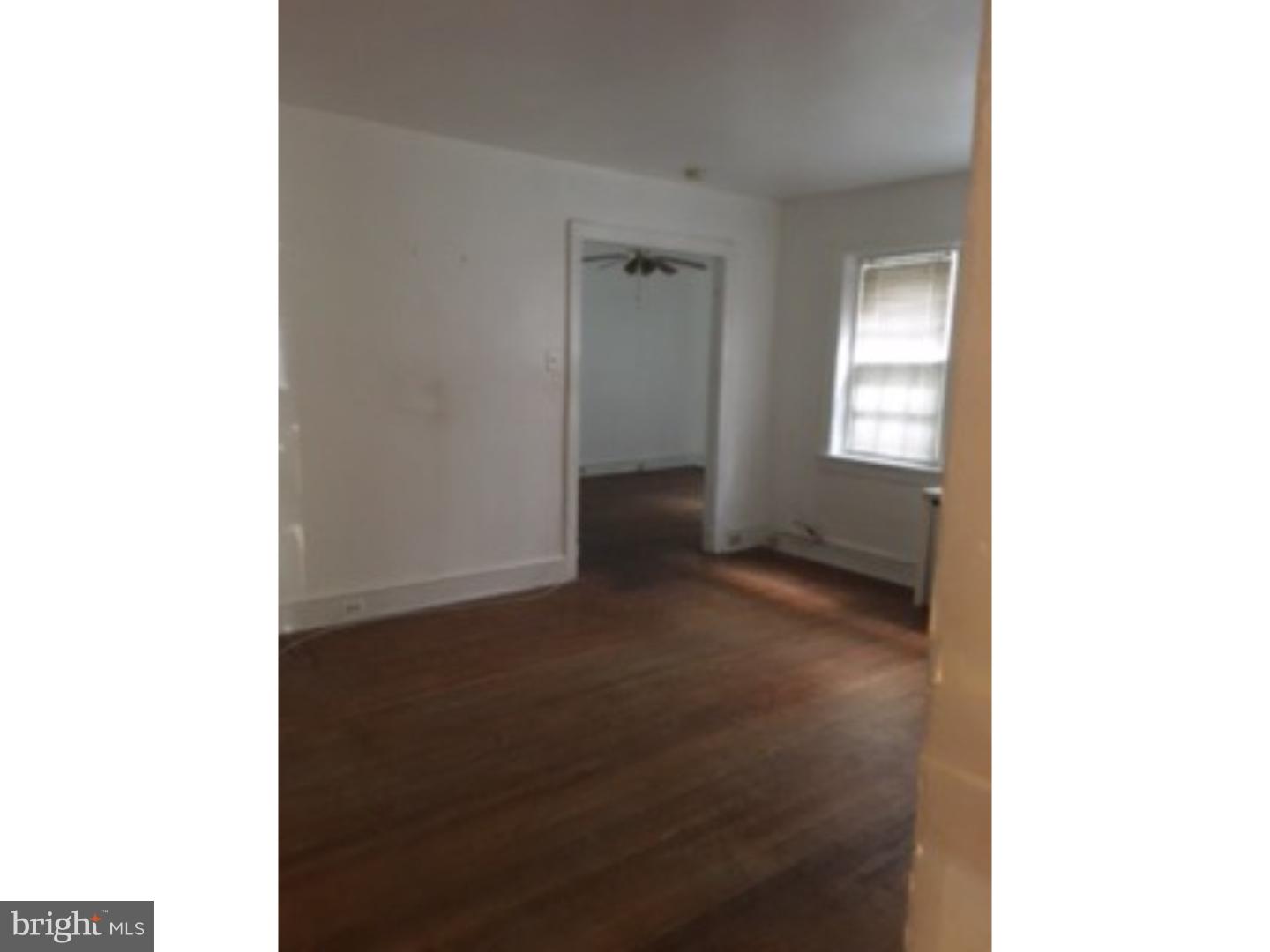 6138 Wayne Avenue, Unit 2 Philadelphia, PA 19144 - Photo 2 of 11 a black and white photo of a living room