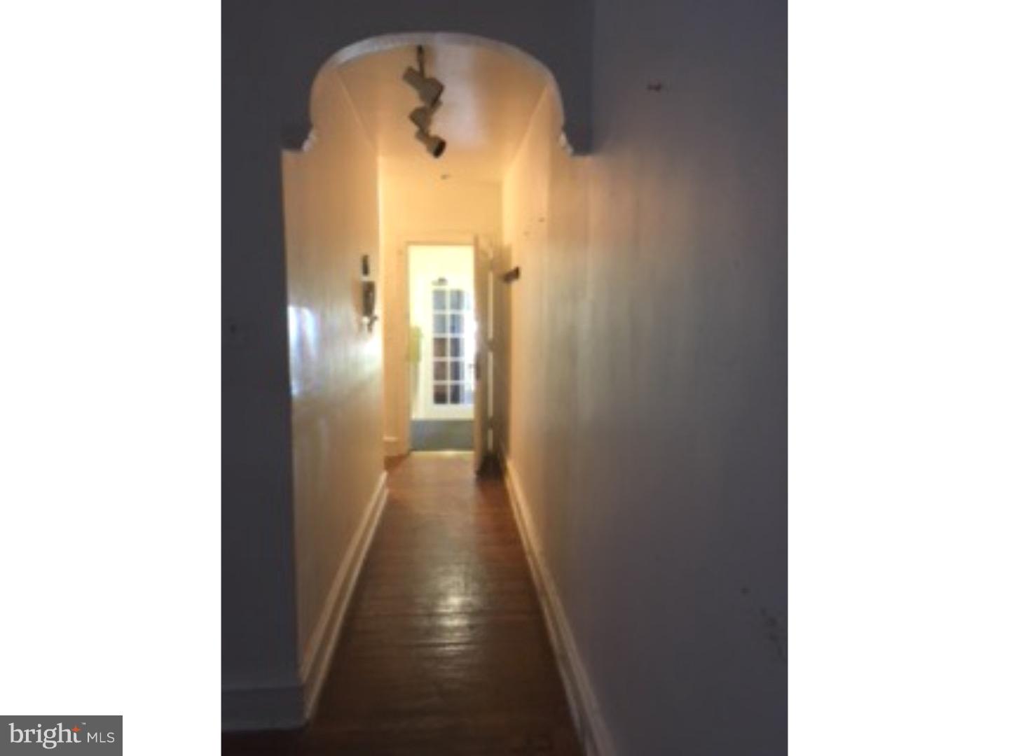 6138 Wayne Avenue, Unit 2 Philadelphia, PA 19144 - Photo 5 of 11 a view of a hallway with wooden floor