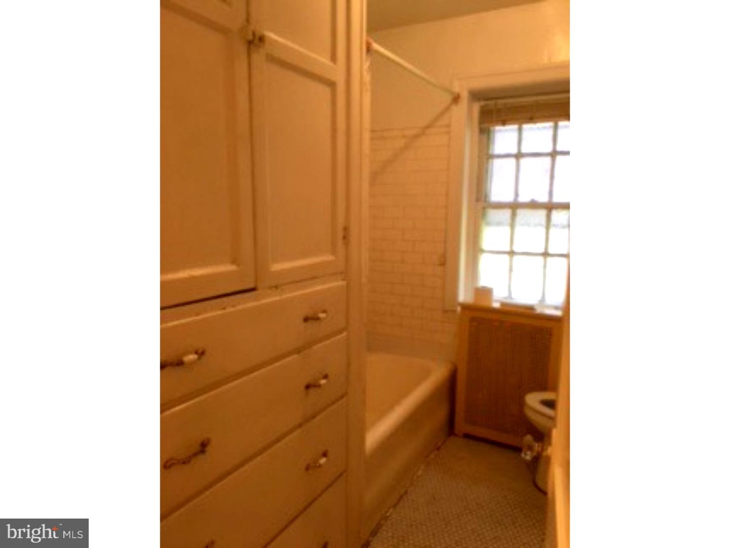 6138 Wayne Avenue, Unit 2 Philadelphia, PA 19144 - Photo 7 of 11 a room with a dresser and a window