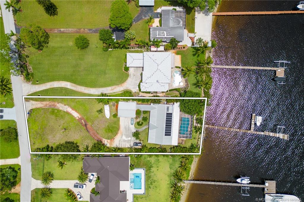 an aerial view of houses with outdoor space