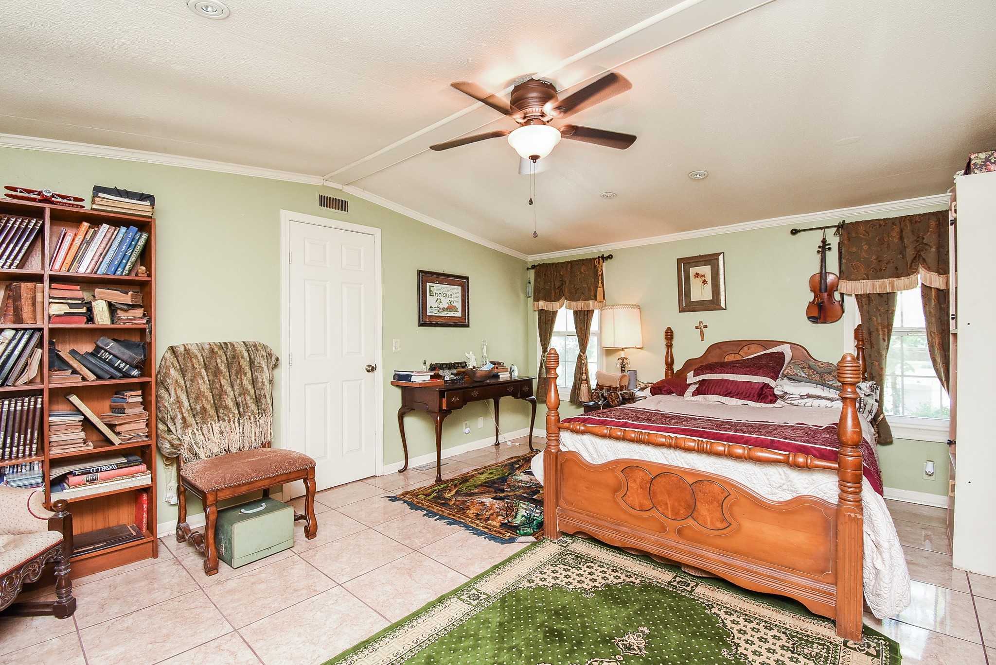 39551 Donigan Road Brookshire, TX 77423 - Photo 23 of 37 Bedroom with light tile patterned flooring, ceiling fan, and crown molding