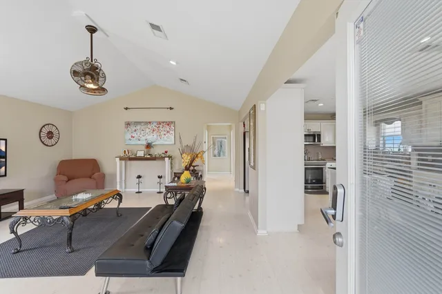 a view of a livingroom with furniture and a window