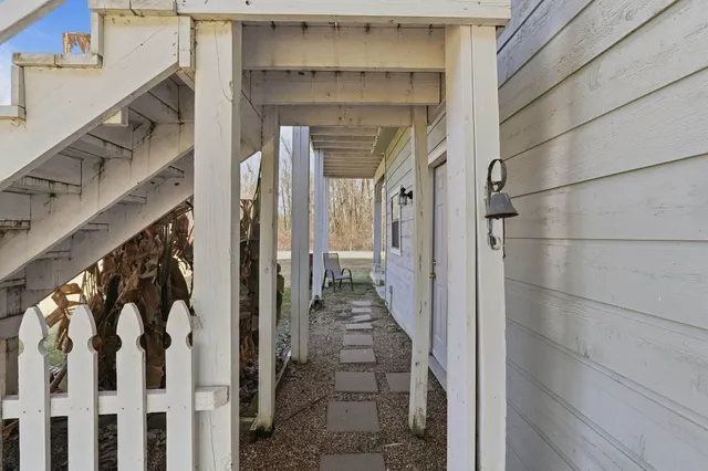 a view of a room with gym equipment and floor to ceiling window
