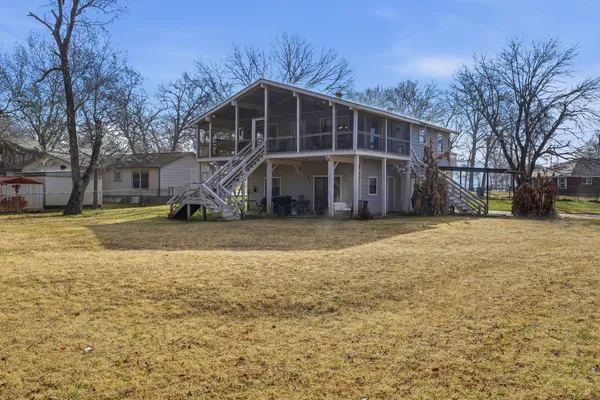 a view of a house with a big yard