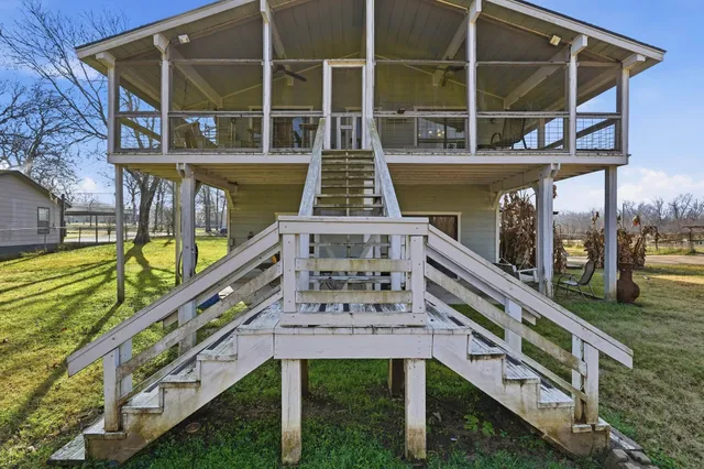 a front view of a house with large windows