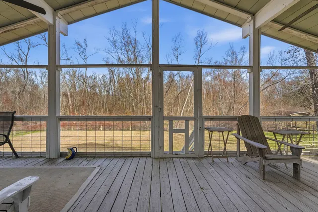 a view of a balcony with wooden floor