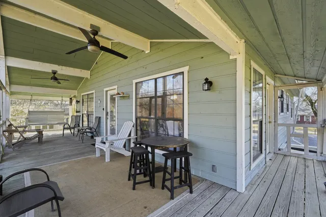 a dining room with furniture and wooden floor