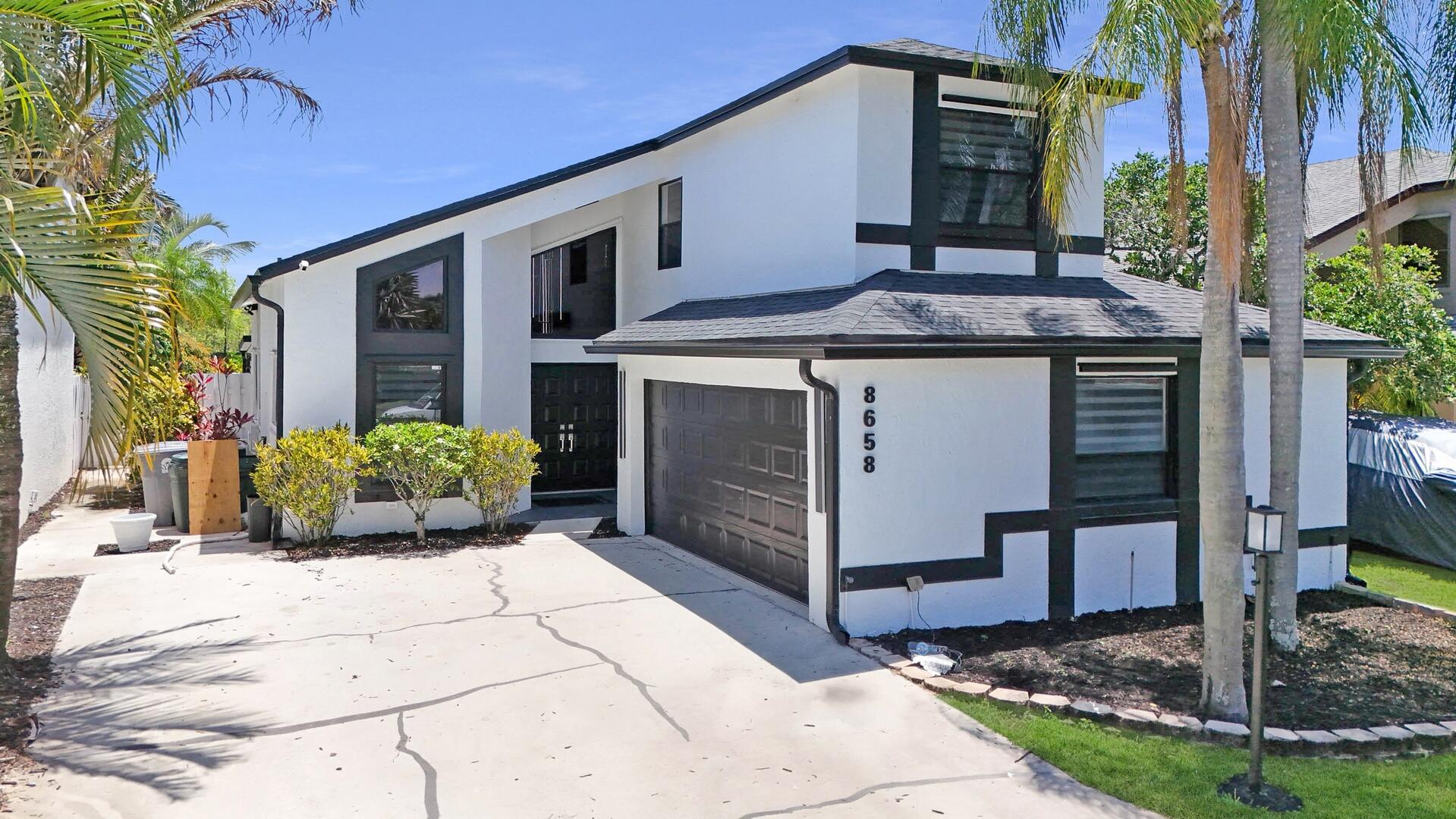 8658 Kimble Way Boca Raton, FL 33433 - Photo 1 of 33 a view of a house with a sink and a yard