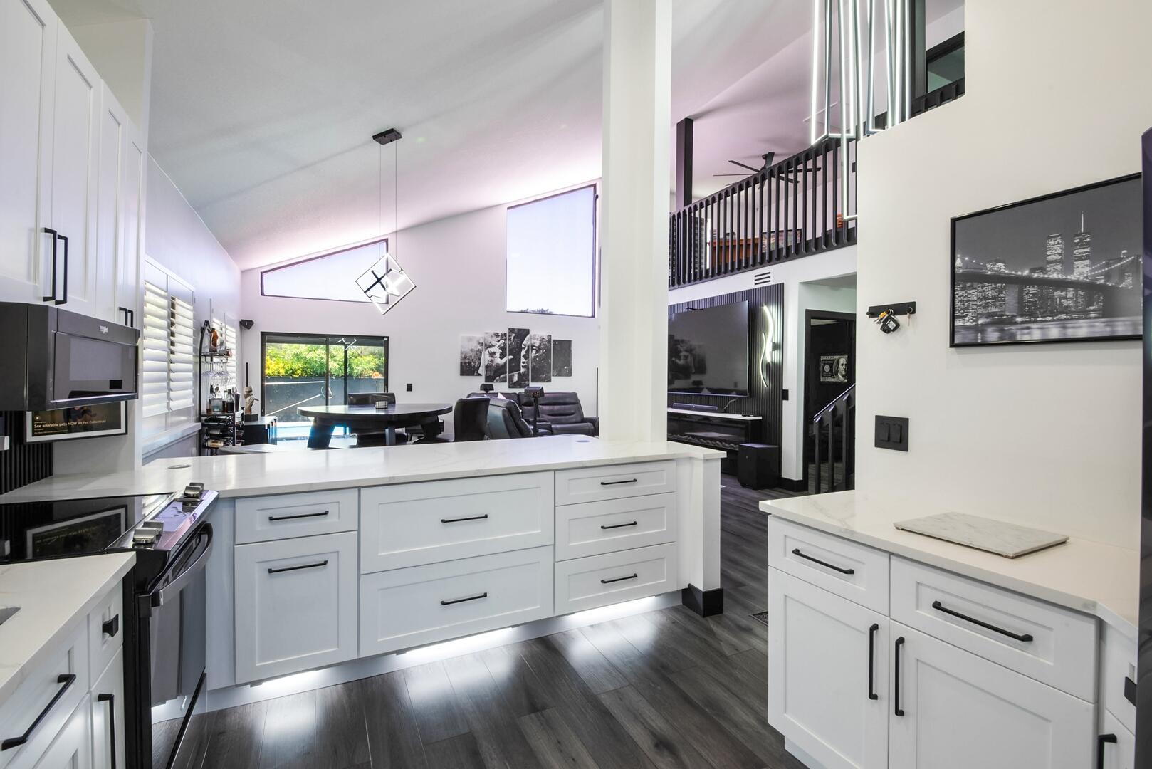 8658 Kimble Way Boca Raton, FL 33433 - Photo 12 of 33 a kitchen with stainless steel appliances kitchen island granite countertop a refrigerator and a stove top oven