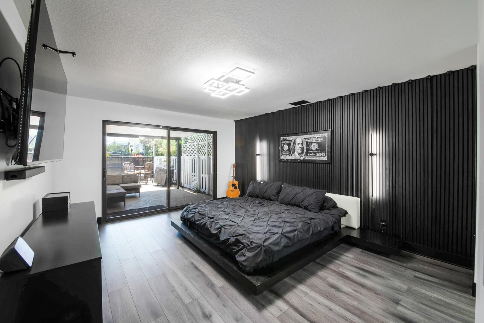 8658 Kimble Way Boca Raton, FL 33433 - Photo 14 of 33 a bedroom with a large bed and a couch