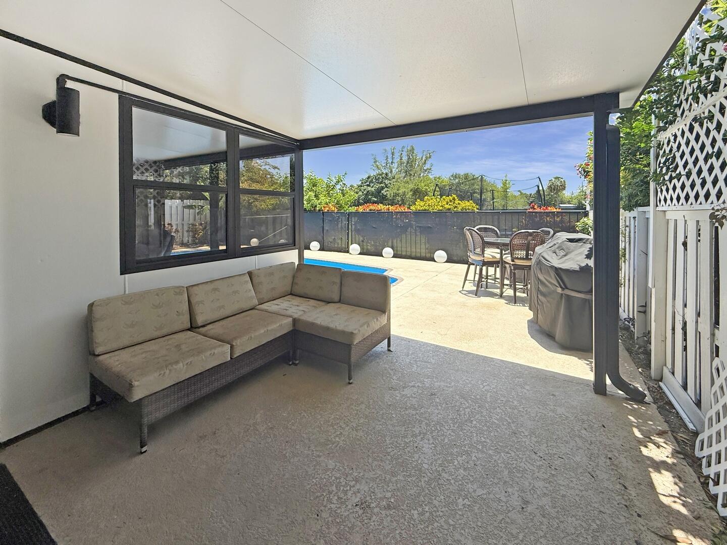 8658 Kimble Way Boca Raton, FL 33433 - Photo 16 of 33 a living room with furniture and a floor to ceiling window