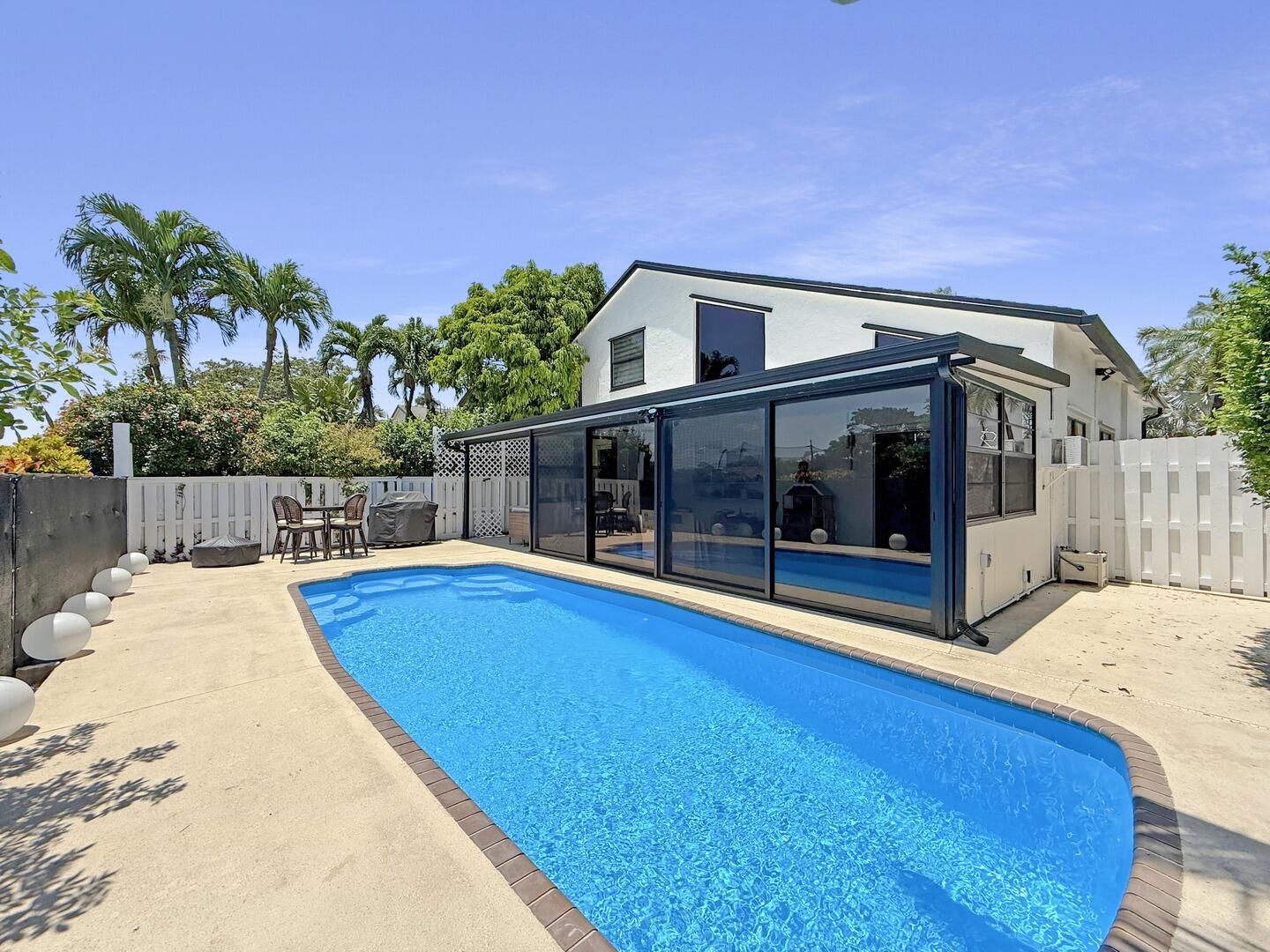 8658 Kimble Way Boca Raton, FL 33433 - Photo 22 of 33 a view of house with swimming pool outdoor seating