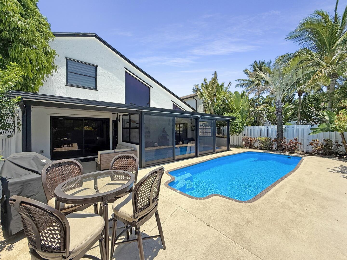 8658 Kimble Way Boca Raton, FL 33433 - Photo 24 of 33 a view of a house with swimming pool and sitting area