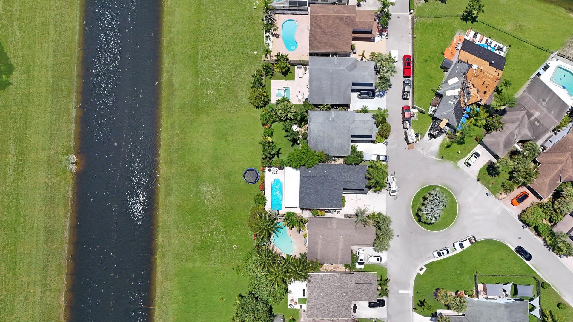 8658 Kimble Way Boca Raton, FL 33433 - Photo 27 of 33 an aerial view of residential house with outdoor space and parking