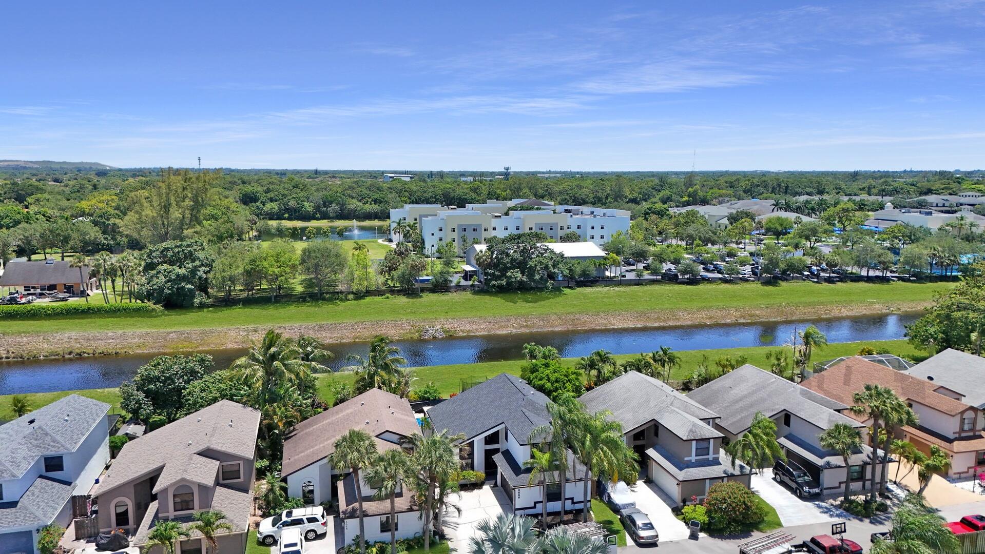 8658 Kimble Way Boca Raton, FL 33433 - Photo 29 of 33 an aerial view of multiple house with a lake view