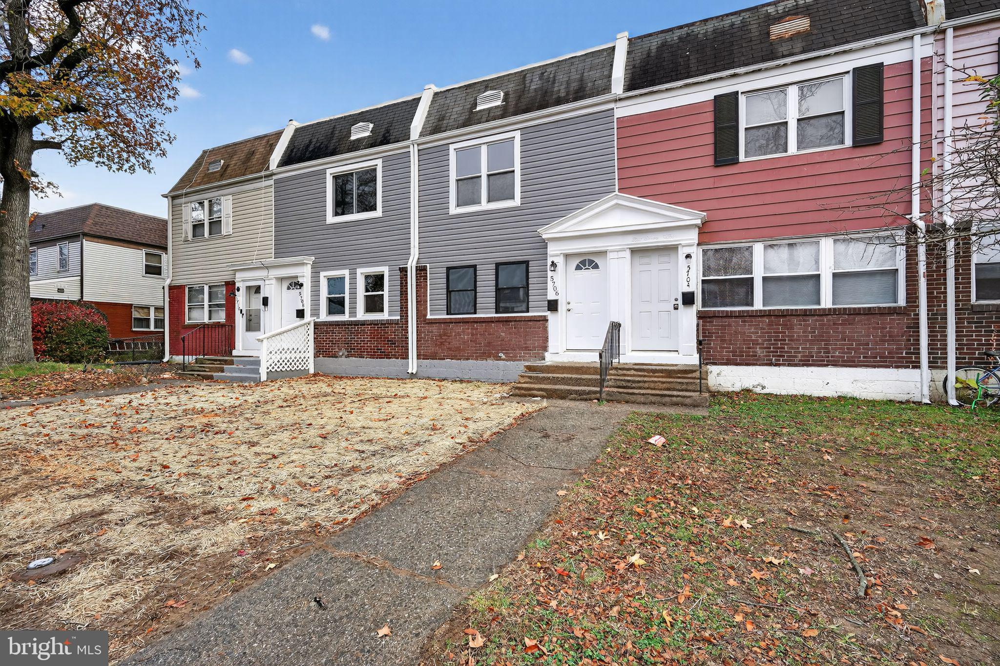 5706 Mitchell Road Levittown, PA 19057 - Photo 17 of 19 a front view of a house with a yard