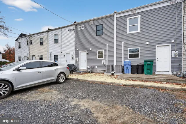 a view of a car parked in front of a house