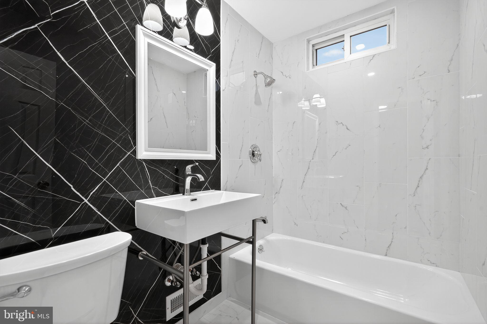 5706 Mitchell Road Levittown, PA 19057 - Photo 9 of 19 a bathroom with a sink and a mirror