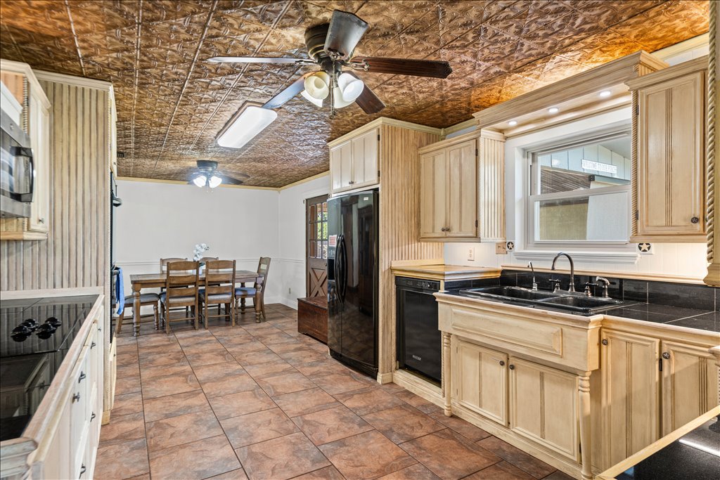 2421 Post Oak Road Webberville, TX 78653 - Photo 11 of 36 Check out the textured, copper-toned tin ceiling!