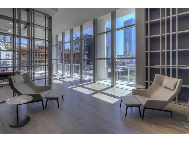 a balcony with table and chairs