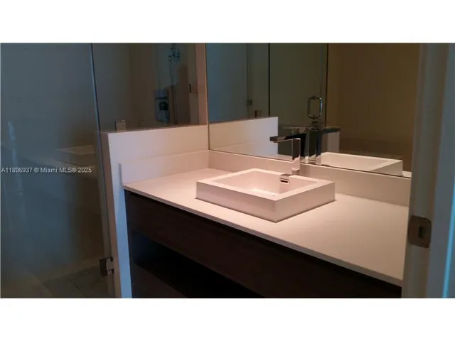 a black and white photo of a sink