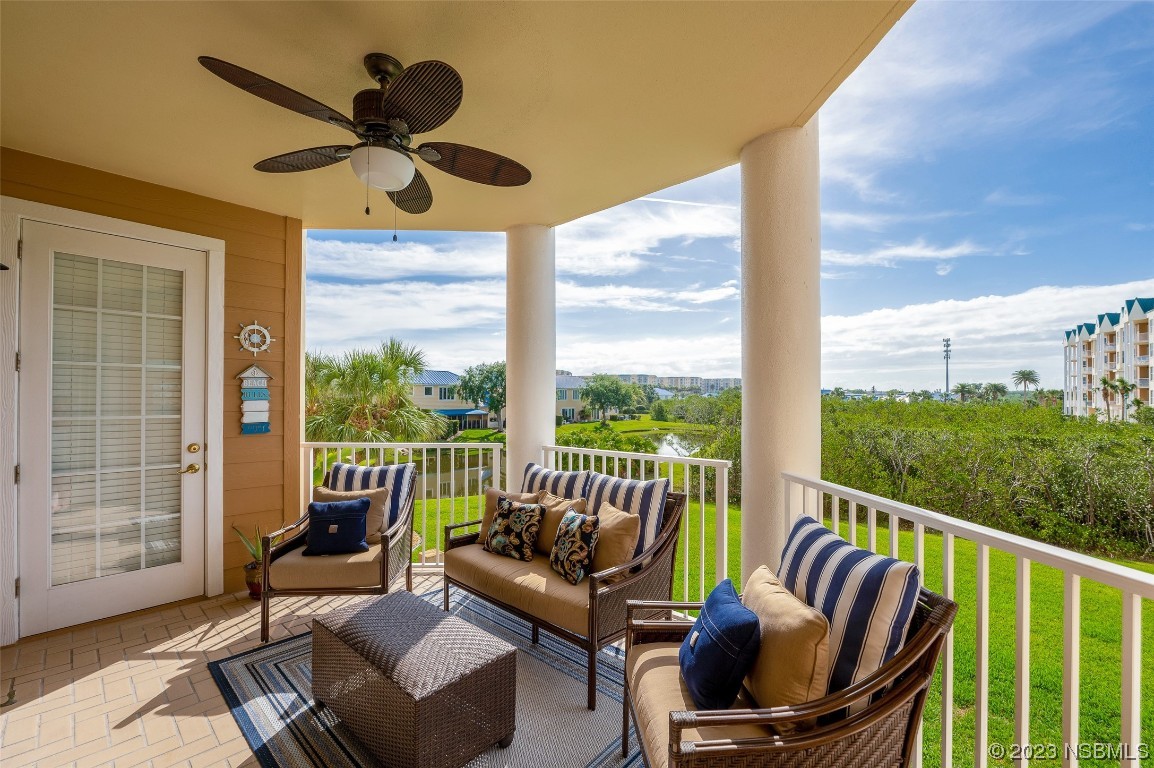 4620 Riverwalk Village Court, Unit 7206 Ponce Inlet, FL 32127 - Photo 18 of 48 a outdoor living space with furniture and garden view