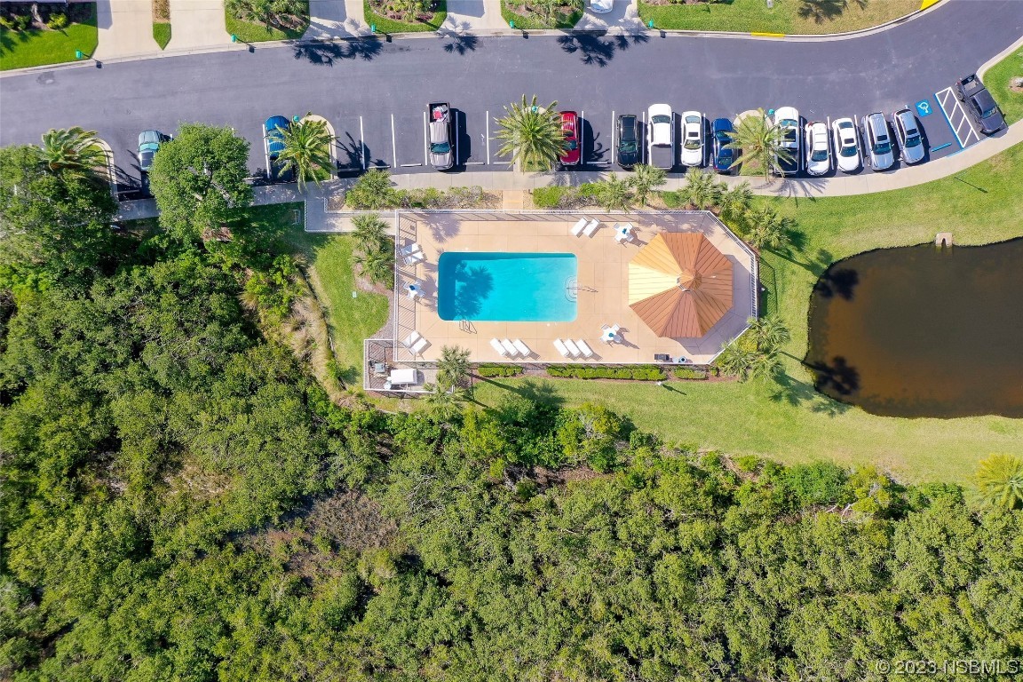 4620 Riverwalk Village Court, Unit 7206 Ponce Inlet, FL 32127 - Photo 26 of 48 a view of a swimming pool with a yard