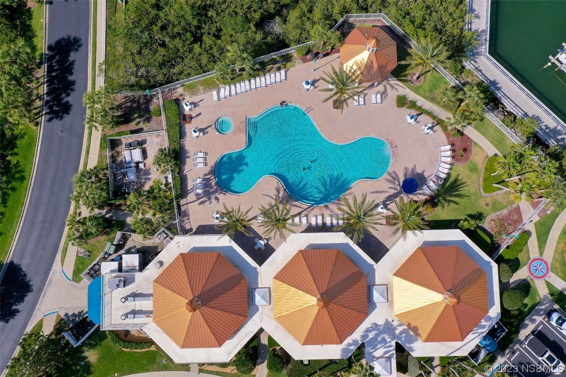 4620 Riverwalk Village Court, Unit 7206 Ponce Inlet, FL 32127 - Photo 28 of 48 an aerial view of a swimming pool and outdoor space