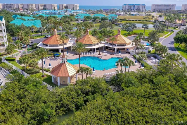 a view of a swimming pool with an outdoor space and seating area