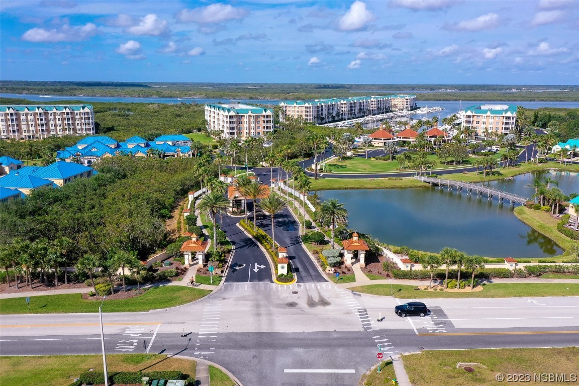 4620 Riverwalk Village Court, Unit 7206 Ponce Inlet, FL 32127 - Photo 35 of 48 a view of a swimming pool with an outdoor space and seating area