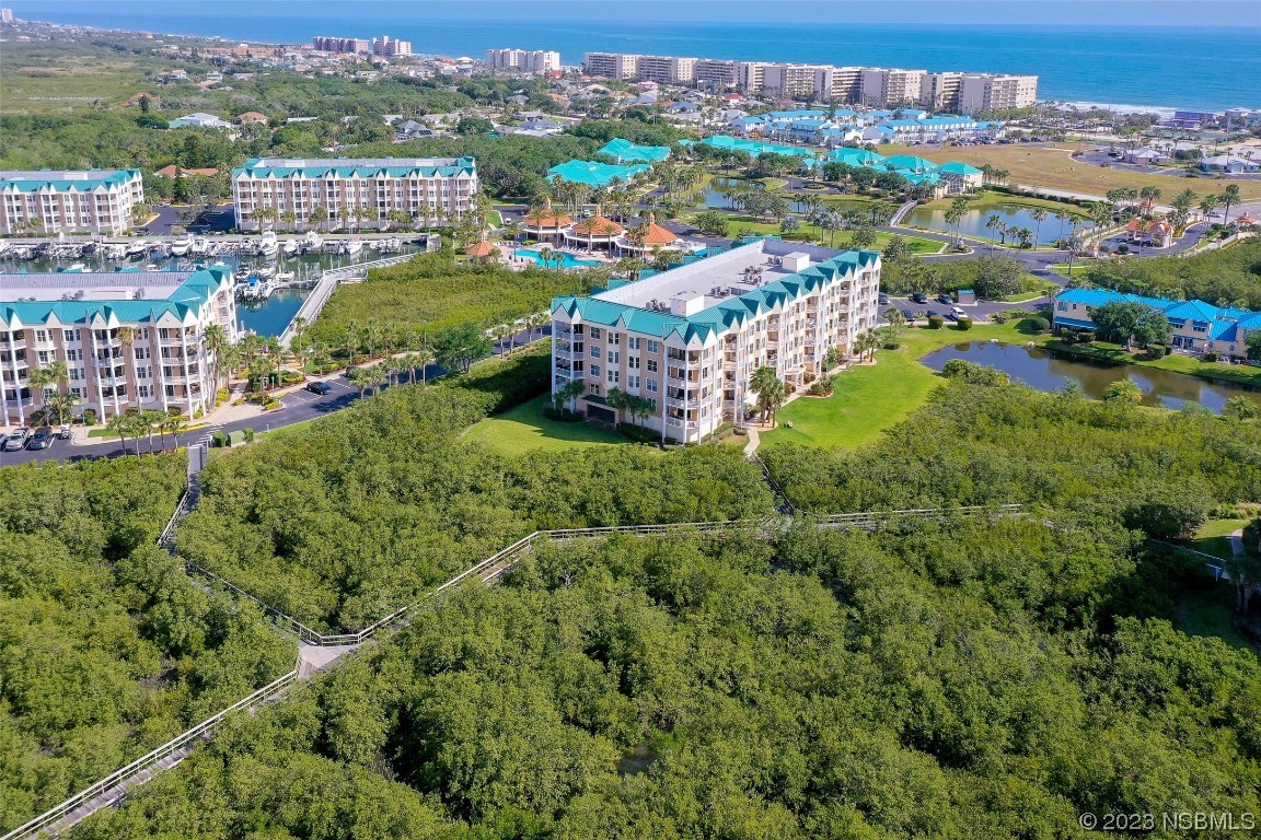 4620 Riverwalk Village Court, Unit 7206 Ponce Inlet, FL 32127 - Photo 36 of 48 an aerial view of multiple house