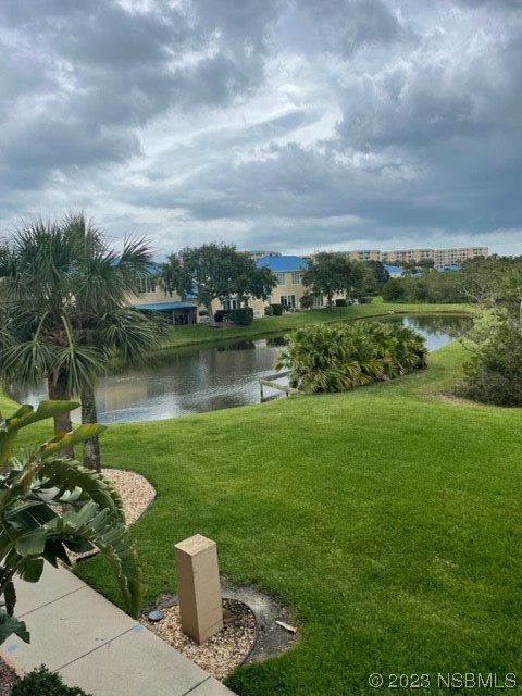 4620 Riverwalk Village Court, Unit 7206 Ponce Inlet, FL 32127 - Photo 48 of 48 a view of a lake with a garden