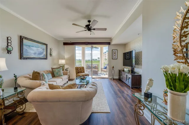 a living room with furniture potted plant and a window
