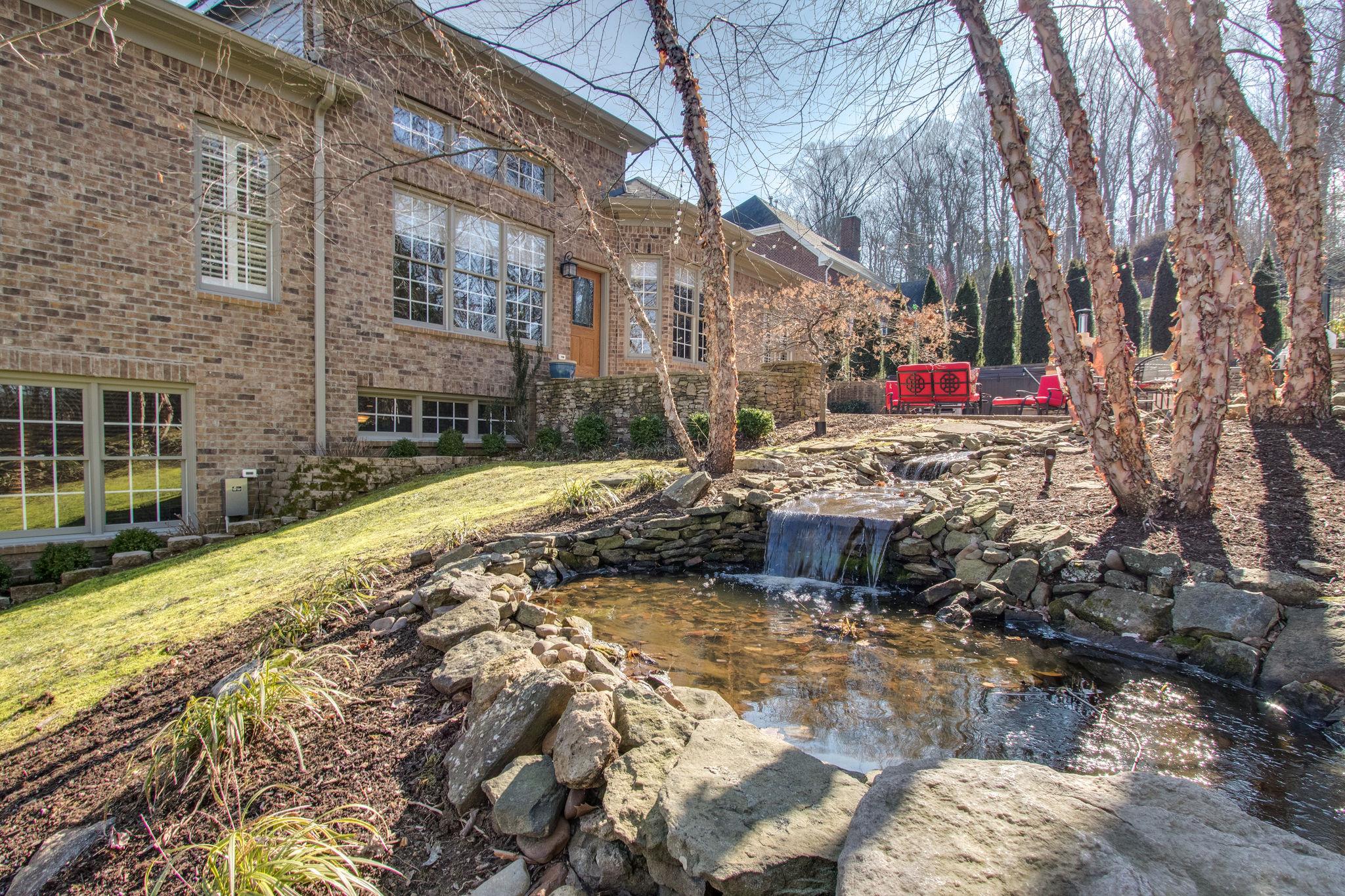 413 Sandcastle Road Franklin, TN 37069 - Photo 28 of 29 The koi pond has a cascading waterfall to enhance the tranquility of this outdoor space.