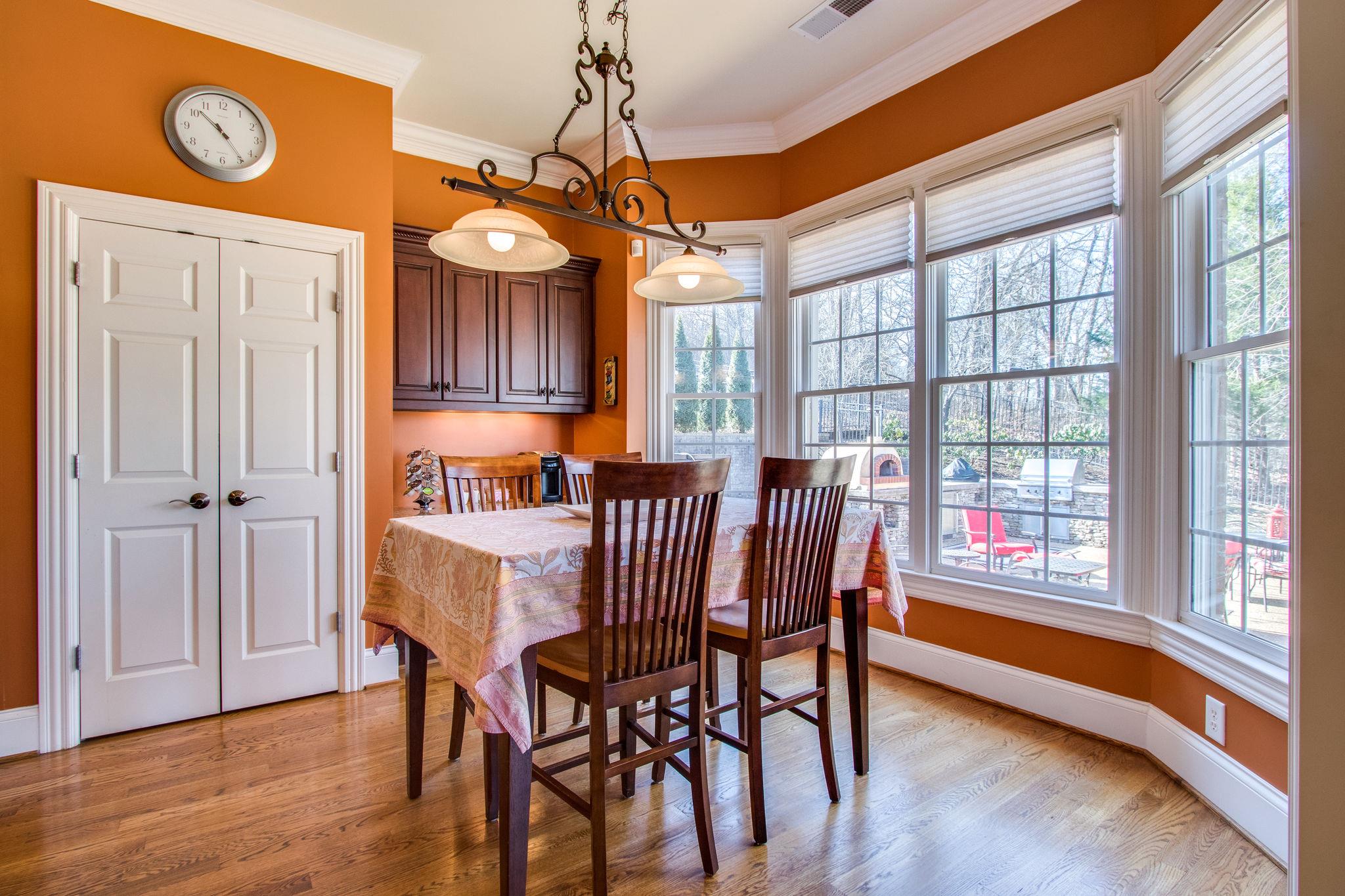 413 Sandcastle Road Franklin, TN 37069 - Photo 7 of 29 The breakfast area is just off the kitchen. The built in desk can also serve as a coffee bar and behind the double doors is a spacious pantry.
