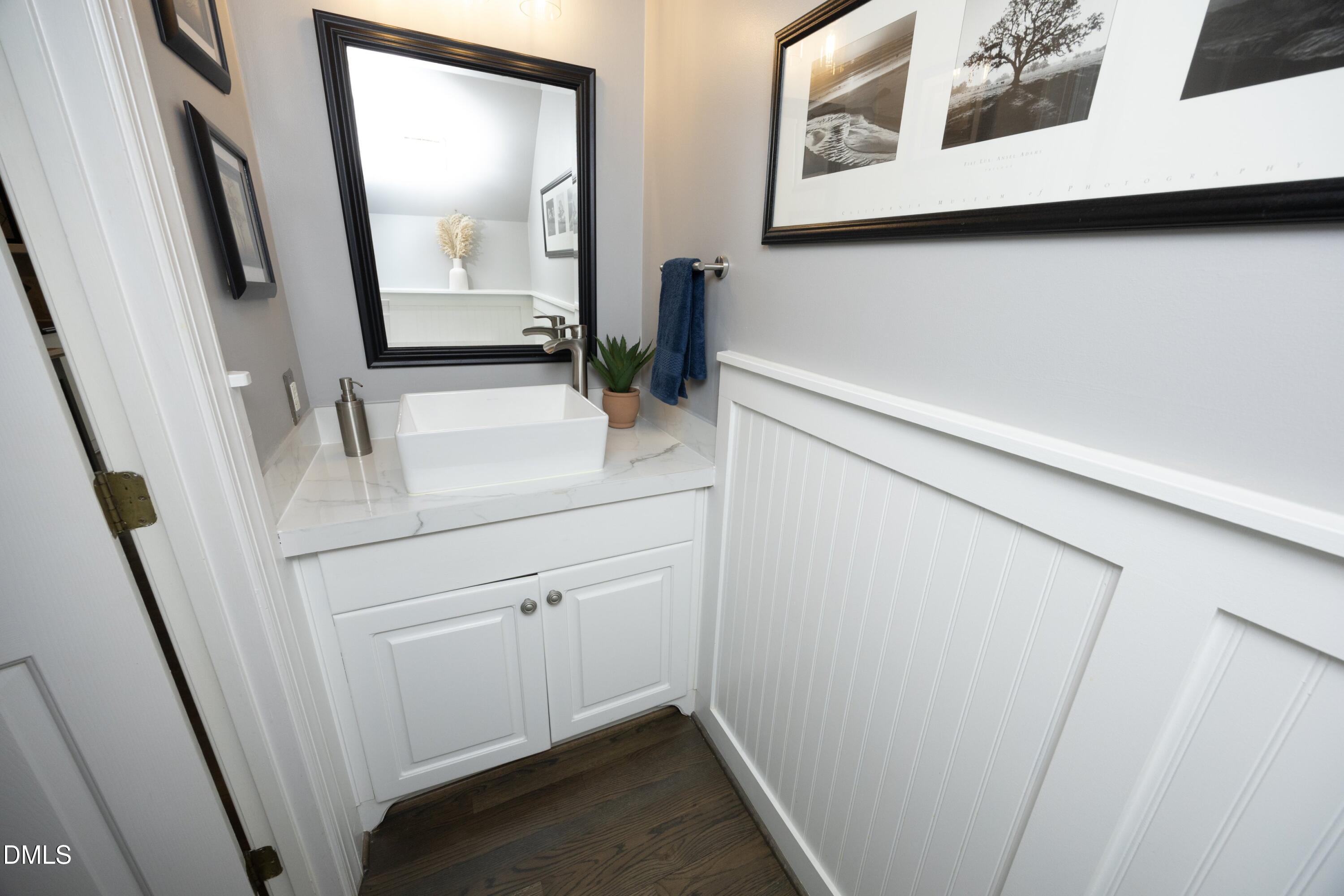 10728 Winding Wood Trail Raleigh, NC 27613 - Photo 17 of 54 a bathroom with a sink and mirror