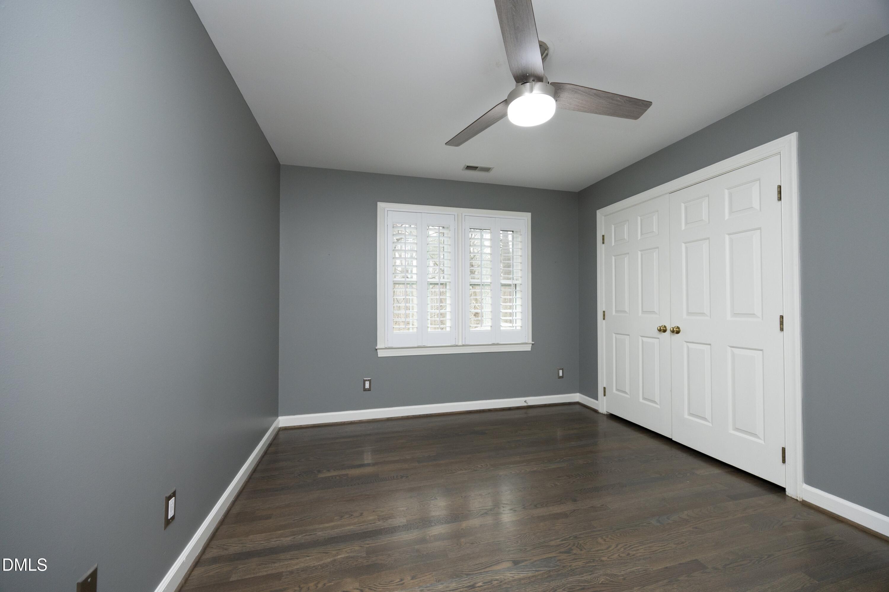 10728 Winding Wood Trail Raleigh, NC 27613 - Photo 24 of 54 wooden floor in an empty room with a window