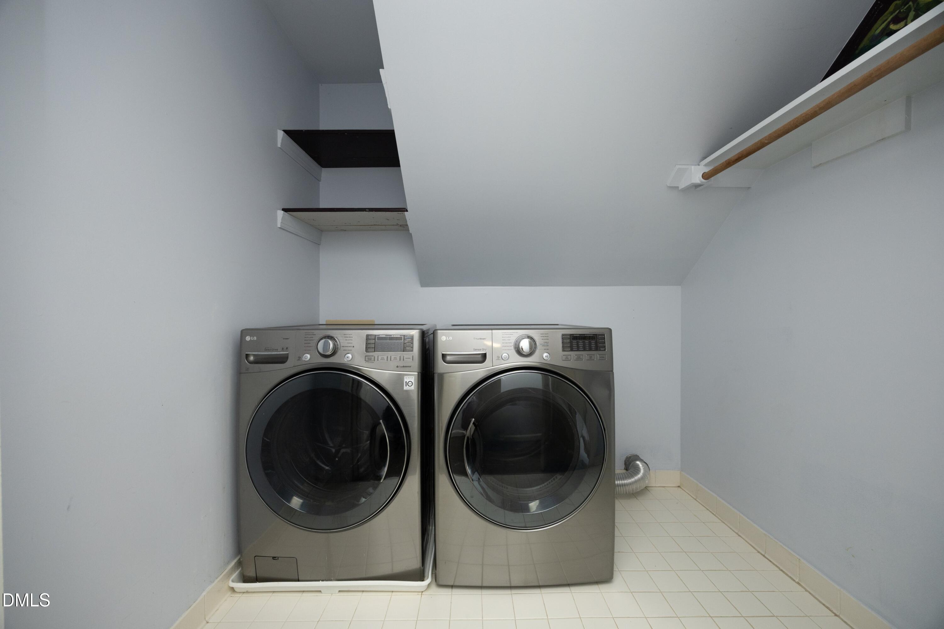 10728 Winding Wood Trail Raleigh, NC 27613 - Photo 30 of 54 a close view of a utility room with dryer and washer