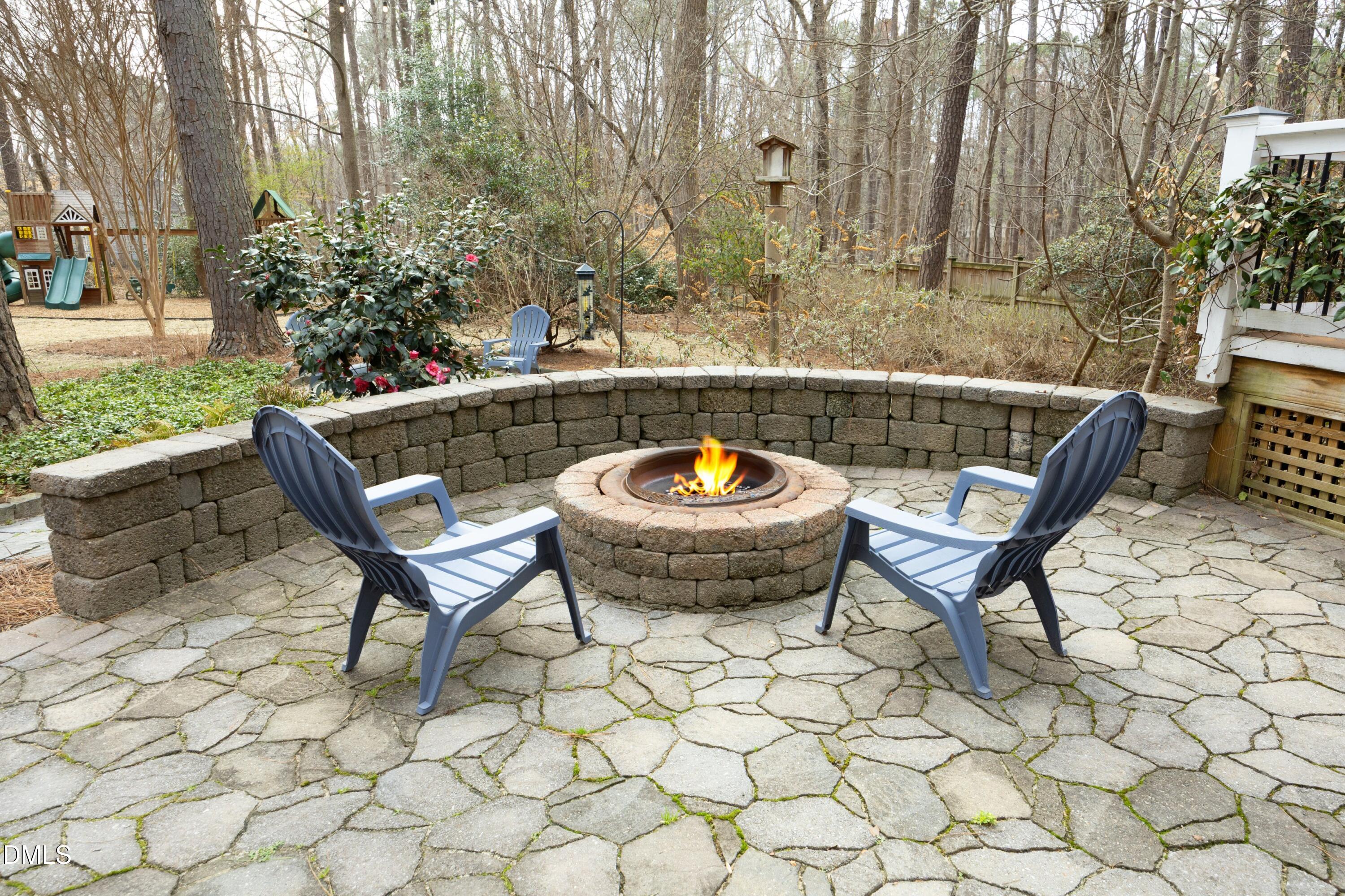 10728 Winding Wood Trail Raleigh, NC 27613 - Photo 34 of 54 a view of a chairs and table in backyard