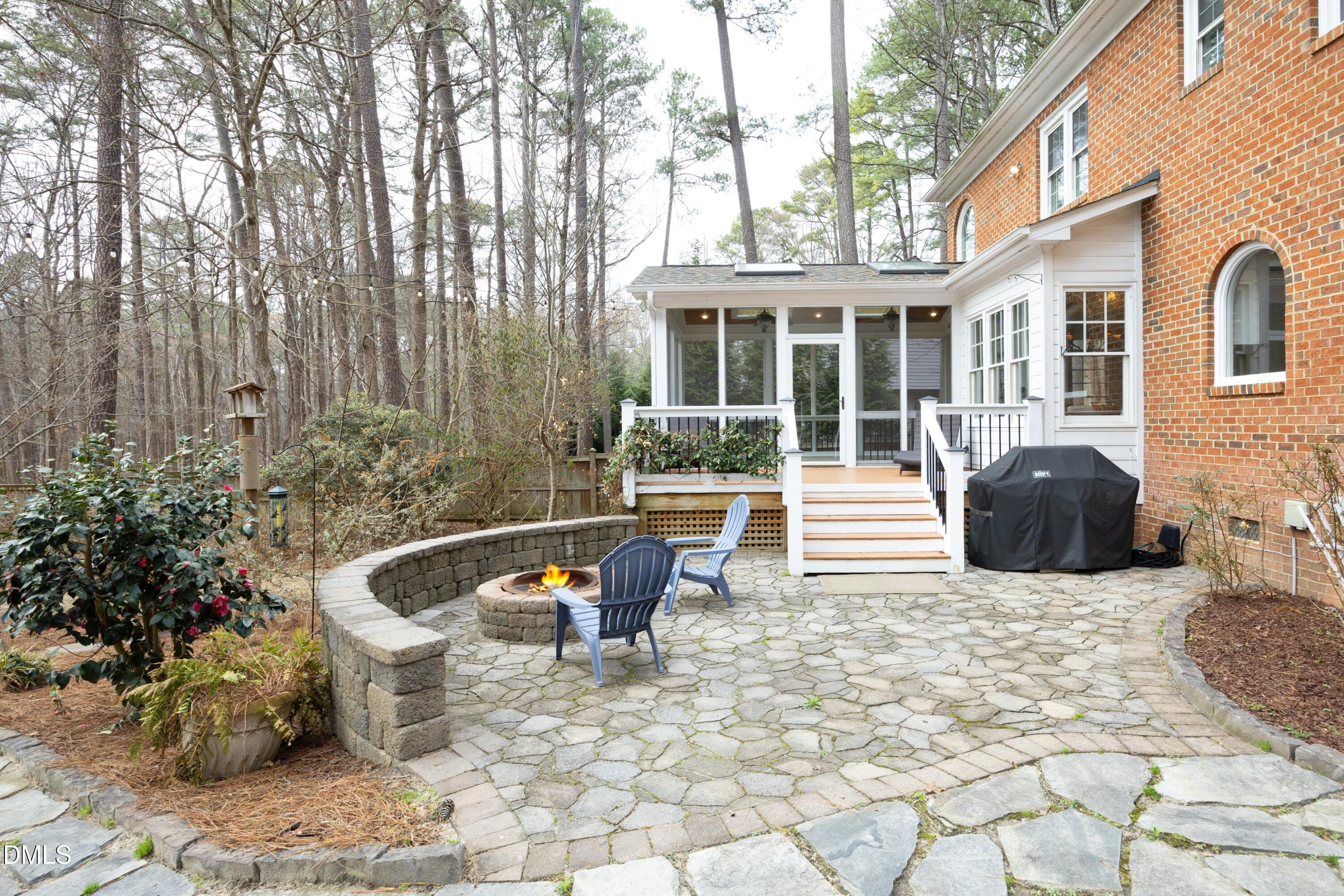 10728 Winding Wood Trail Raleigh, NC 27613 - Photo 35 of 54 a view of a patio with couches chairs and potted plants