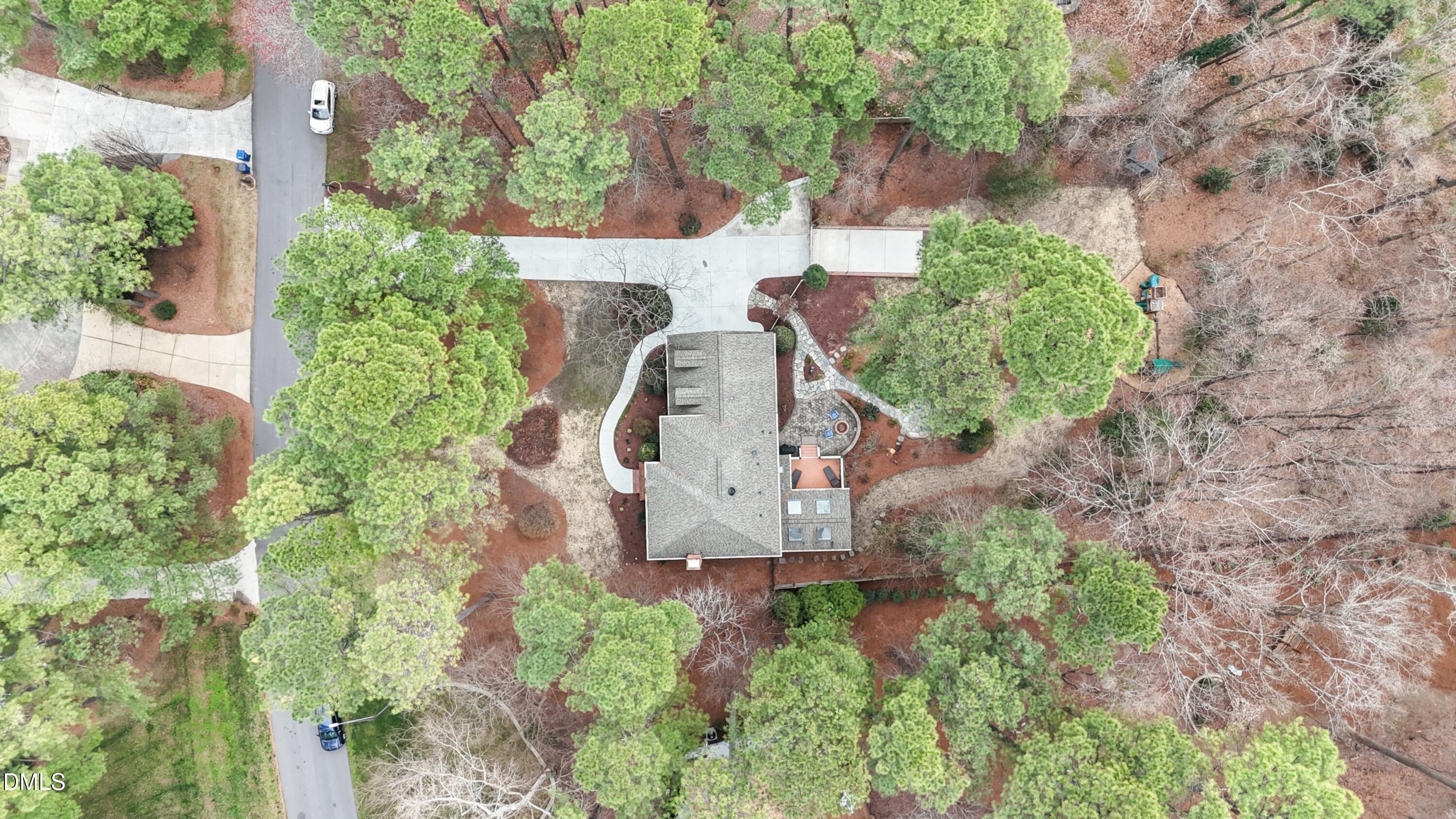 10728 Winding Wood Trail Raleigh, NC 27613 - Photo 46 of 54 an aerial view of a house with a yard and outdoor seating