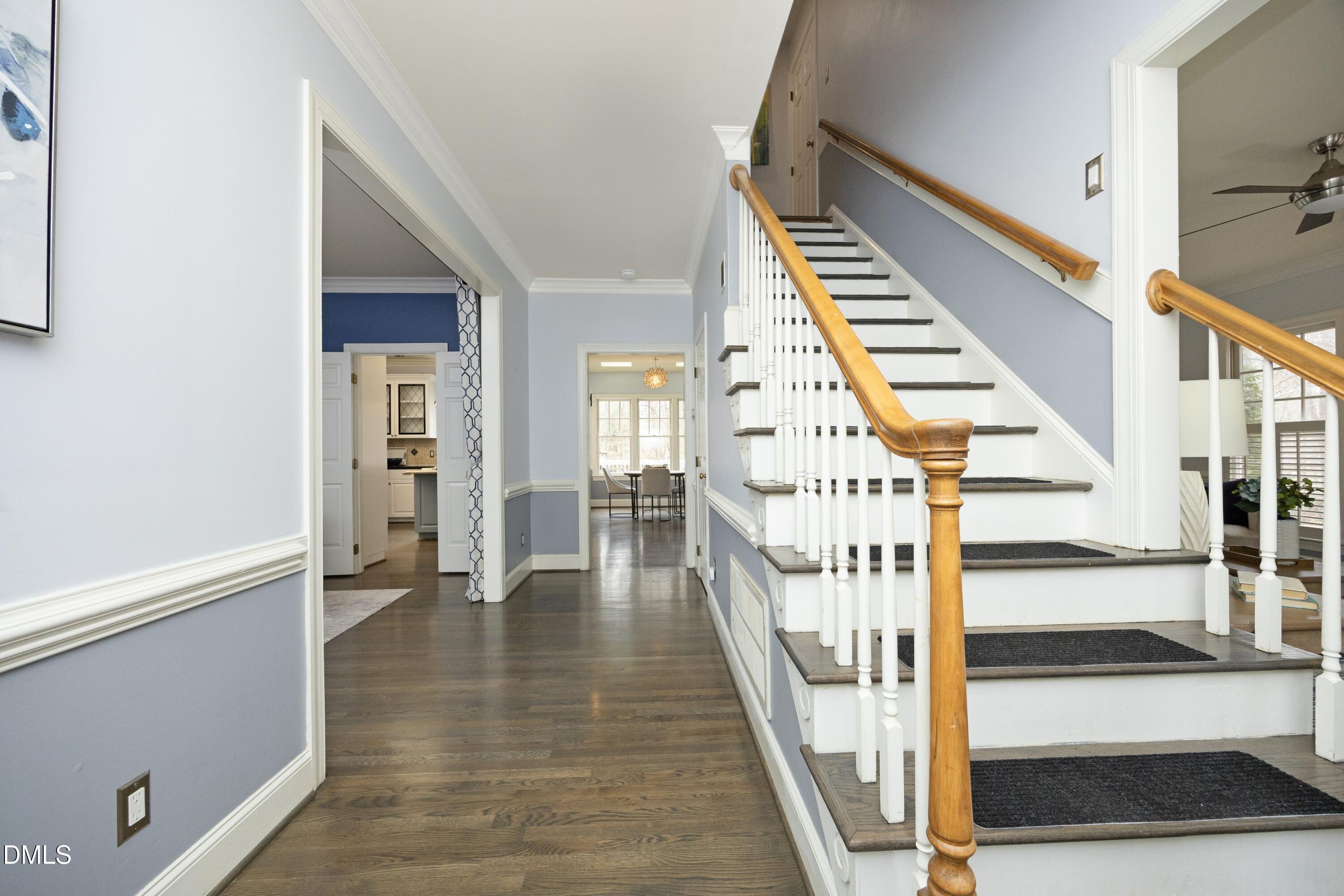 10728 Winding Wood Trail Raleigh, NC 27613 - Photo 4 of 54 a view of an entryway with wooden floor