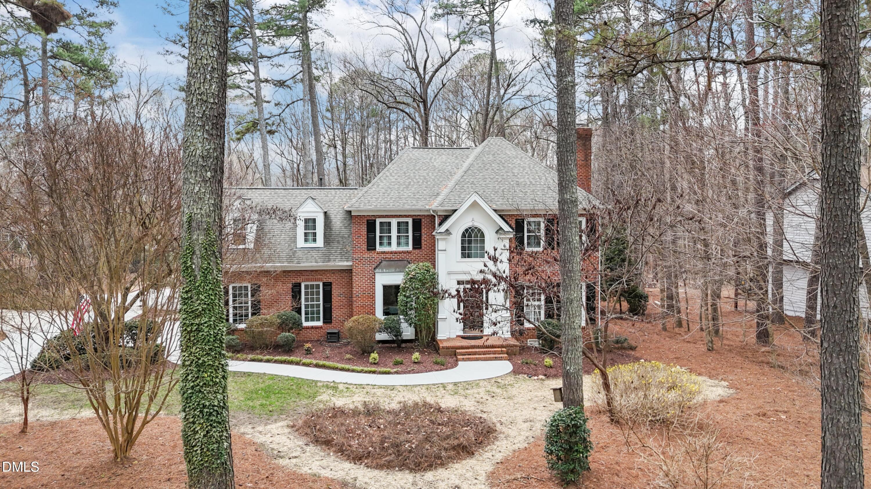 10728 Winding Wood Trail Raleigh, NC 27613 - Photo 51 of 54 front view of a house with a yard