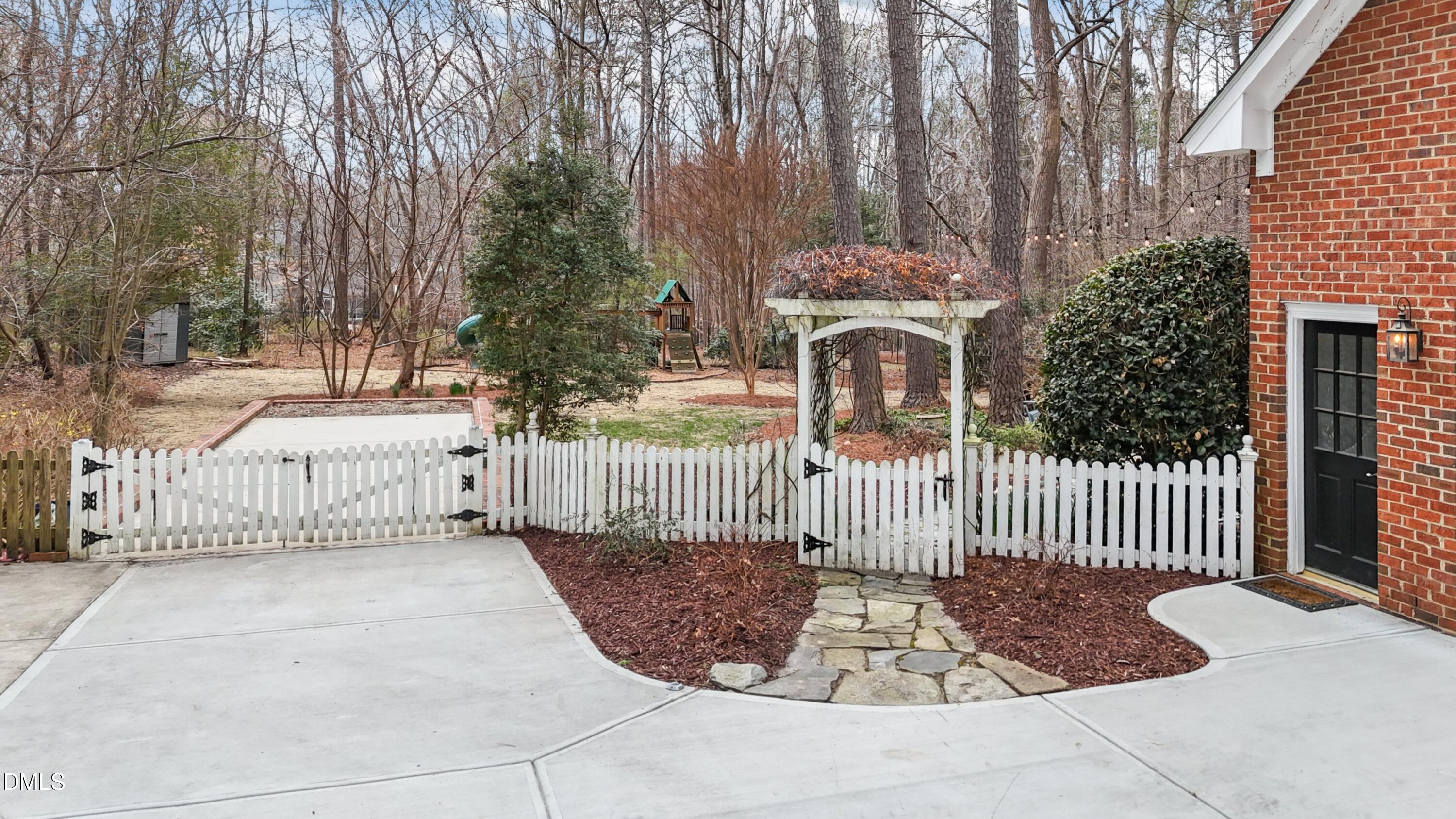 10728 Winding Wood Trail Raleigh, NC 27613 - Photo 52 of 54 a view of a wrought iron fences in front of house