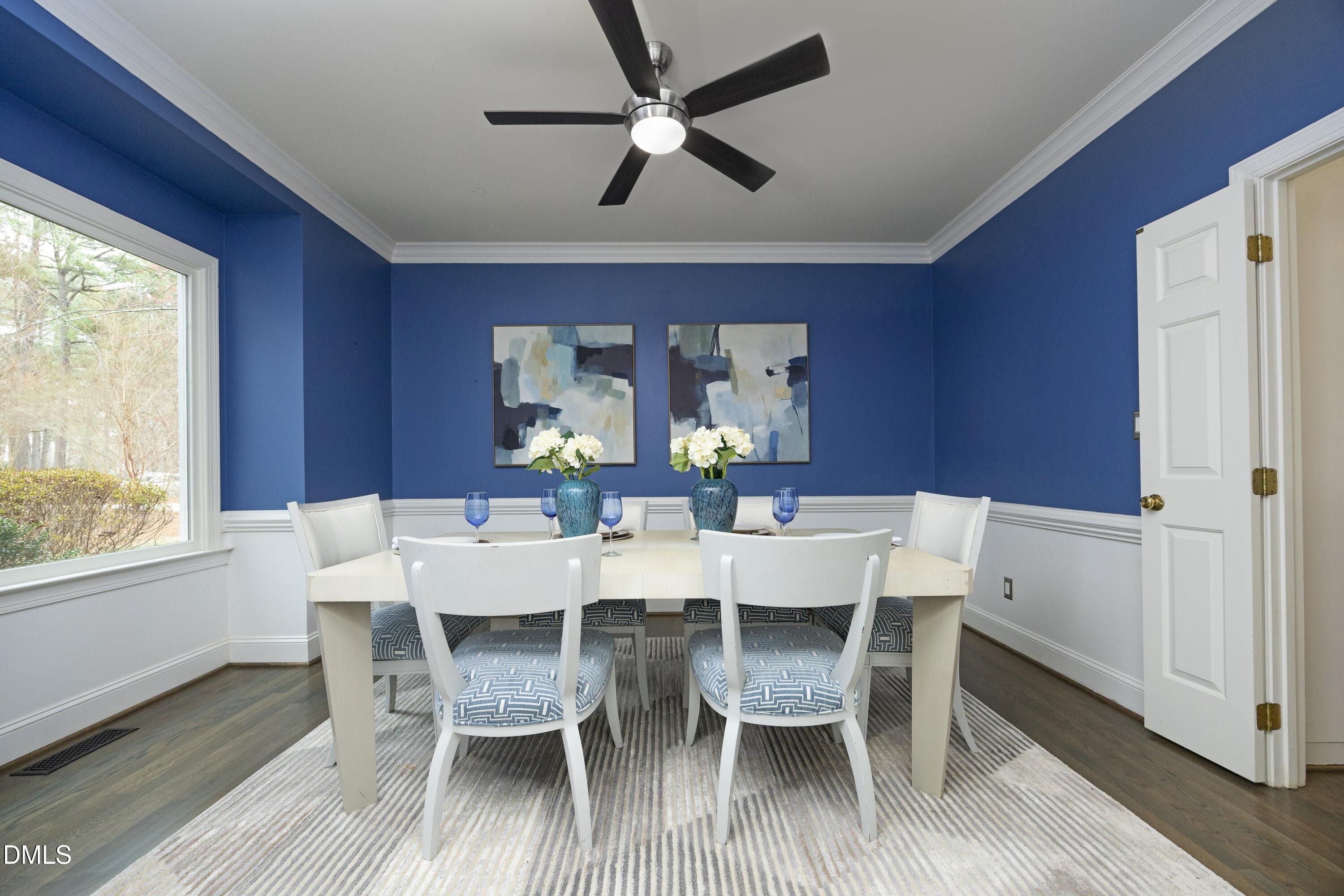 10728 Winding Wood Trail Raleigh, NC 27613 - Photo 5 of 54 a view of a dining room with furniture window and wooden floor