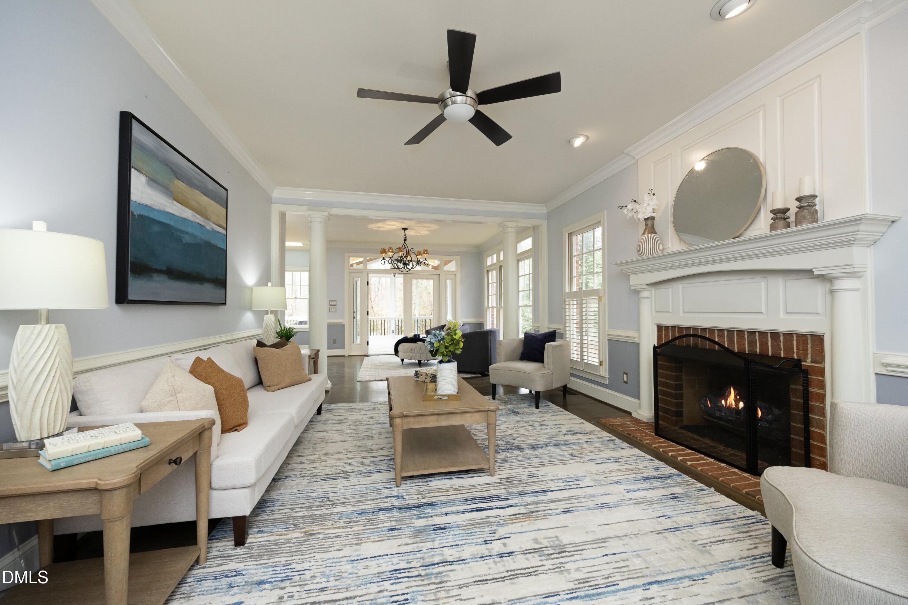 10728 Winding Wood Trail Raleigh, NC 27613 - Photo 6 of 54 a living room with furniture and a fireplace