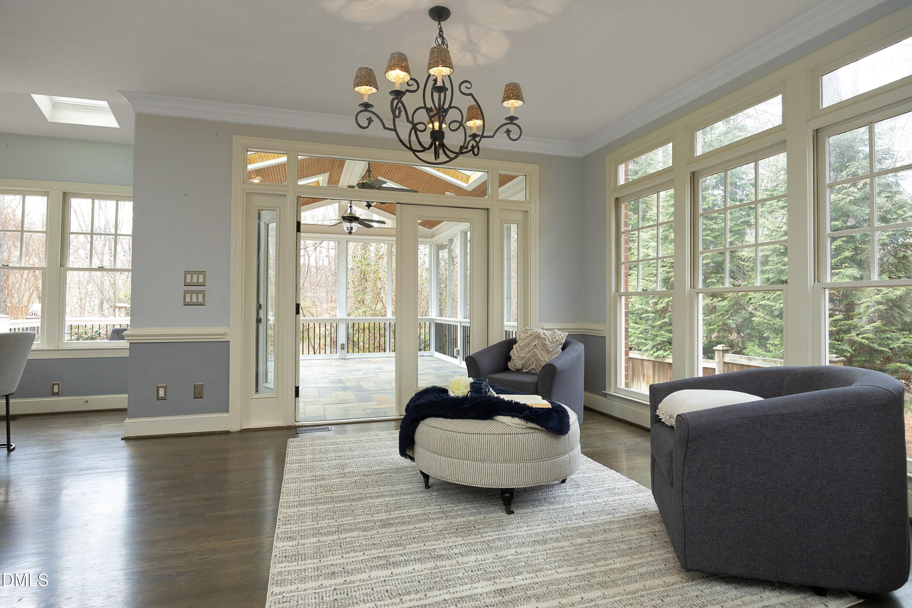 10728 Winding Wood Trail Raleigh, NC 27613 - Photo 9 of 54 a living room with furniture and a large window